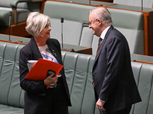 Australian Prime Minister Anthony Albanese speaks to Independent member of parliament, Helen Haines, in the House of Representatives at Parliament House in Canberra, Australia, Tuesday, Aug. 18, 2026.