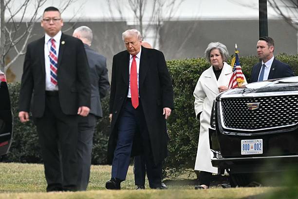 US President Donald Trump, accompanied by Chief of Staff Susie Wiles, arrives at the White House.