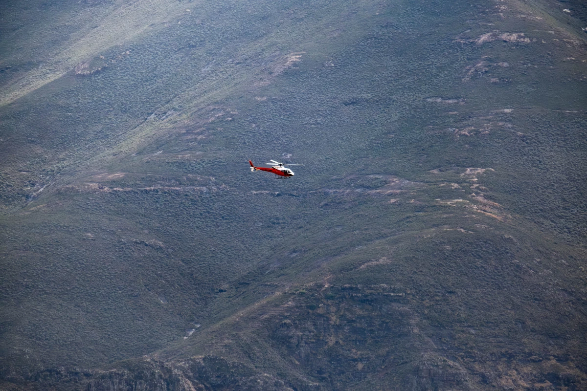 A helicopter transports a medical team from the Lesotho Flying Doctor Service. The LFDS relies on helicopters and single engine airplanes to reach remote communities.