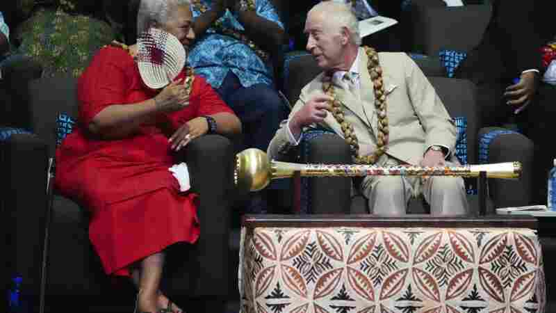Britain's King Charles and Samoan Prime Minister Afioga Fiamē Naomi Mataʻafa, left, talk during the opening ceremony for the Commonwealth Heads of Government meeting in Apia, Samoa, Friday.