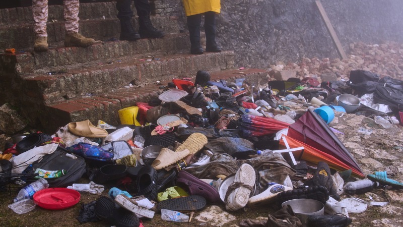 The shoes of victims of a deadly stampede sit by the main entrance of the Citadelle Laferriere in Milot, Haiti, Sunday, April 12, 2026.