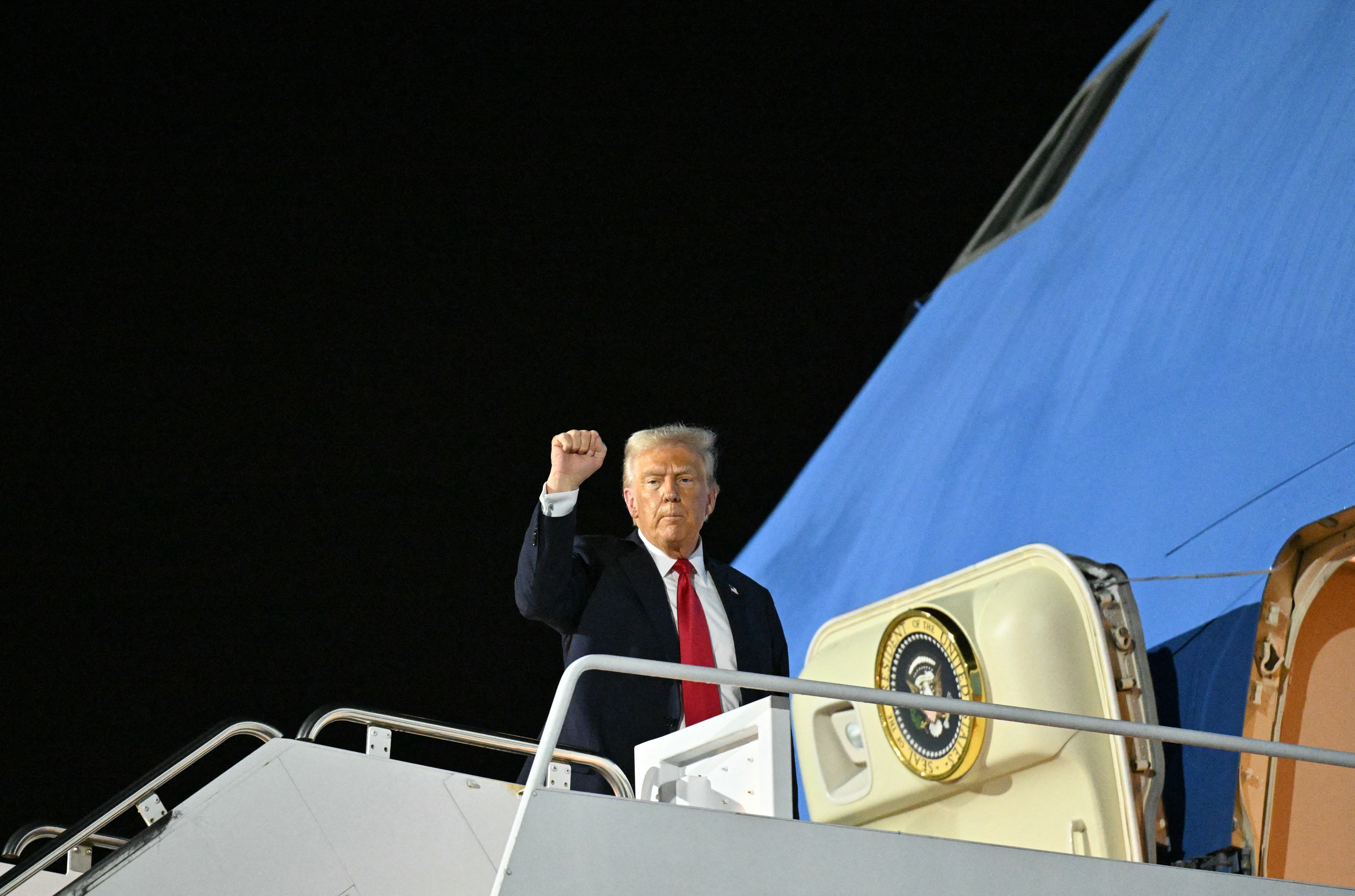 President Trump boards Air Force One in Louisiana as he returns to Washington after attending Super Bowl LIX.
