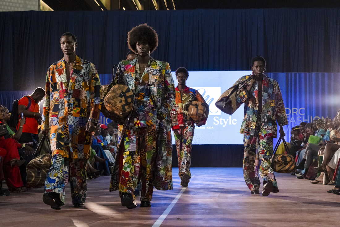 Models wearing designs by Moussa Style walk the runway during DRC Fashion Week at Galerie La Fontaine.