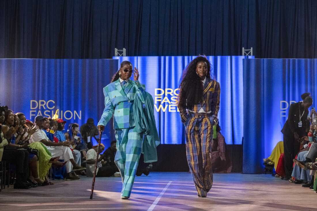 DRC Fashion Week co-founders Bénie Nyota and Nathalie Eoma walk the runway during the event at Galerie La Fontaine.