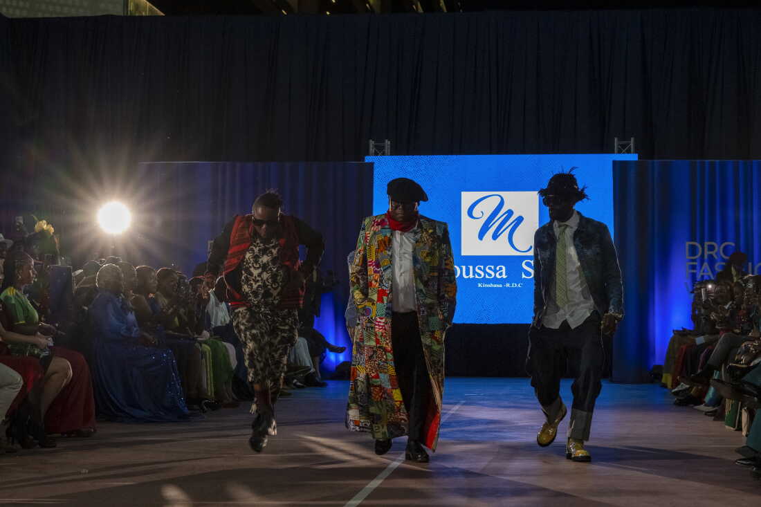 Zachariie Bababaswe and members of Les Léopards de la SAPE perform during a fashion show at DRC Fashion Week at Galerie La Fontaine in the Gombe district of Kinshasa, Democratic Republic of Congo, on Aug. 15.