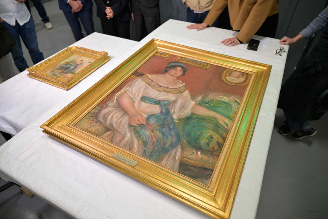Recovered paintings "Portrait of Madame Colonna Romano", right, and "Young Woman at the Well," stolen from the Renoir Museum in Cagnes-sur-Mer are on display at the Interdisciplinary Centre for the Conservation and Restoration of Heritage in Marseille, France, Monday Oct. 12, 2026.