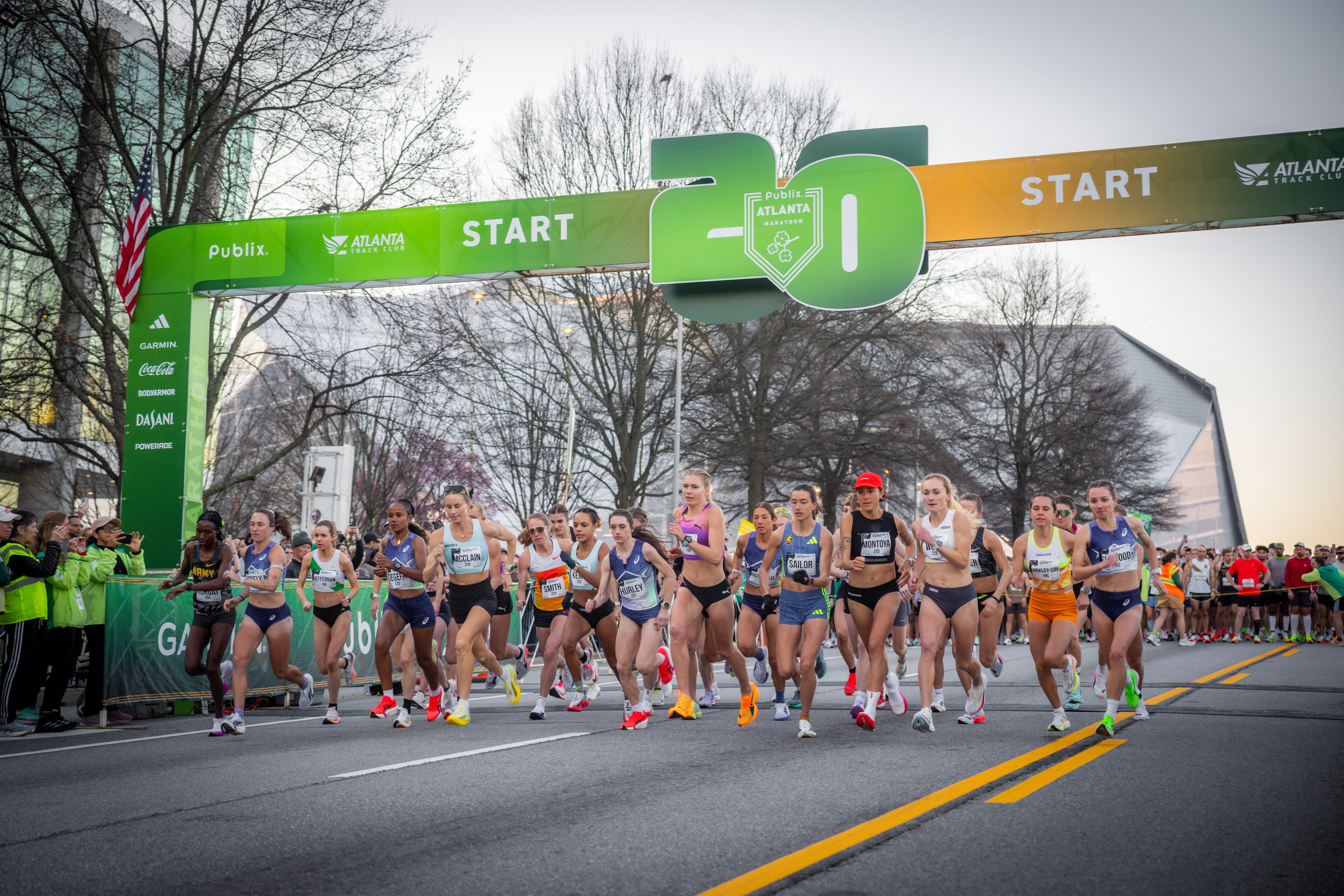 Elite female distance runners take off at the start of the Atlanta Half Marathon on March 1. Jess McClain, middle left, led much of the race before an official car led her off course.