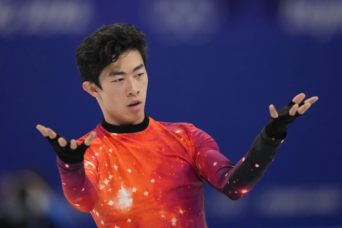 Nathan Chen competes in the men's free skate program during the figure skating event at the 2022 Winter Olympics, Thursday, Feb. 10, 2022, in Beijing. The U.S. team will finally be awarded its long-delayed gold medal at a ceremony on Paris.