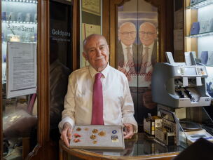 Gold expert and market analyst Mehmet Ali Yıldırımtürk holds a display tray of historical and modern gold coins at his shop inside the Grand Bazaar in Istanbul, Turkey, on Aug. 26, 2026.
The collection includes traditional Ottoman-era coins, such as Reşat and Hamit gold in the middle, alongside modern Turkish Republic coins, including Ata and ribboned Çeyrek gold on the left. On the right is a 1-gram gold piece, which was introduced to the market in 2016 as a more affordable way for people to buy gold.