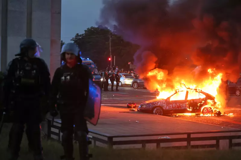 A car burns as PSG supporters celebrate in Paris, Saturday, May 30, 2026 after the Champions League final soccer match between Paris Saint-Germain and Arsenal that's being played in Budapest., PSG won the game.