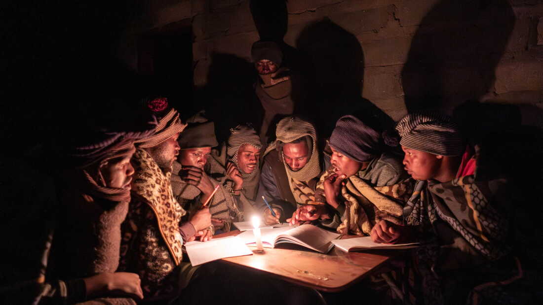 Shepherds attend a part time night school near Mokhotlong, Lesotho. For many, these classes, which occur roughly twice a month, are the only form of education they can access.