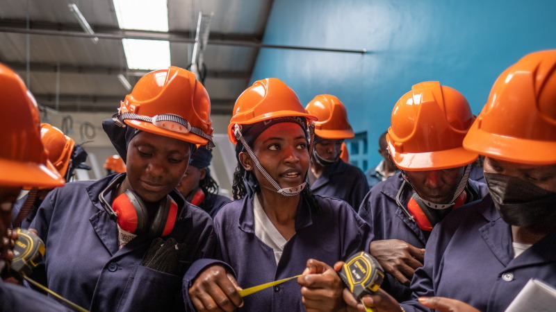 Students take part in a tiling class at the Buildher training facility in Nairobi, Kenya.
