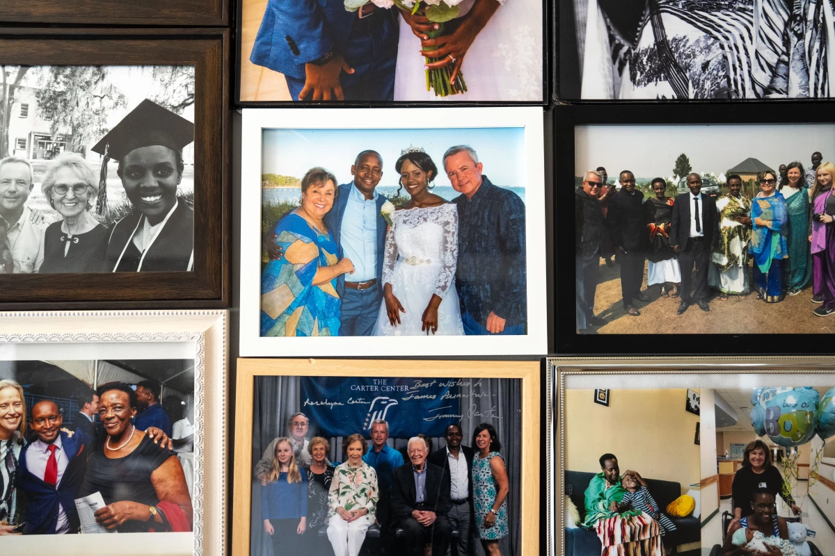 Center: James Kassaga Arinaitwe and his wife, Daphine Namara, on their wedding day in St. Teresa, Fla., in October 2019. They're flanked by the U.S. couple who took him in when he began college: Russell and Cheri Rainey.