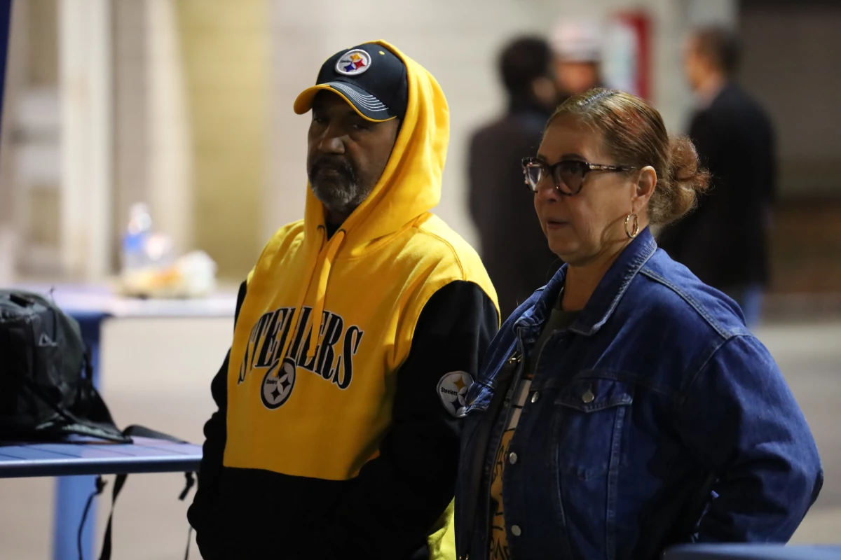 Osvaldo and Eva Clemente attend a rally organized by the Democratic party in Reading, Pa., on Nov. 2, 2024.
