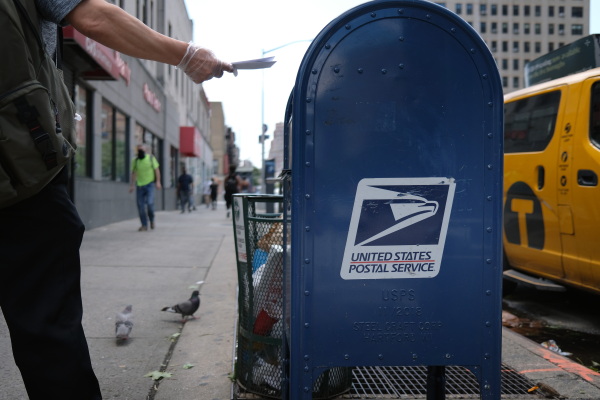 A United States Postal Service (USPS) mail box stands in Manhattan on August 05, 2020 in New York City. Mail services will not be affected by the government shutdown.