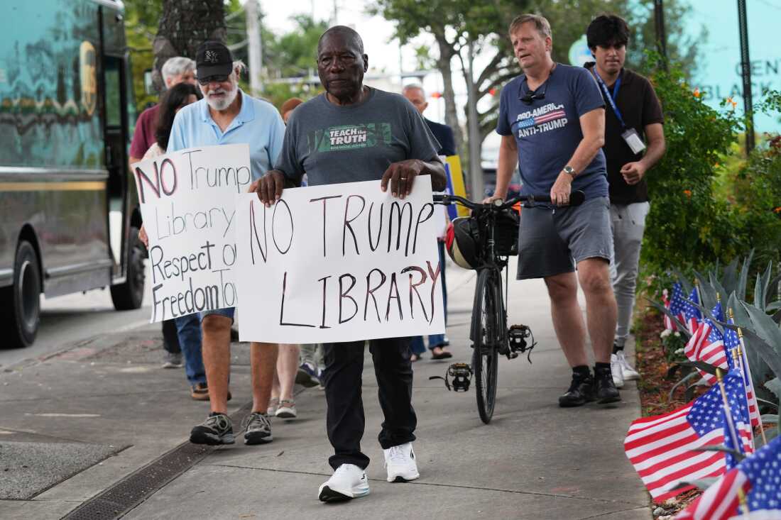 Marvin Dunn, center, and other Miami residents protested the Miami Dade College's donation in November. 