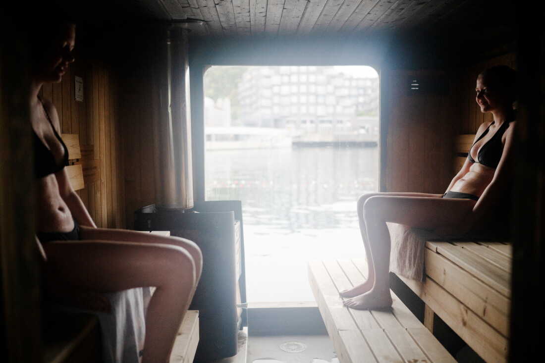 Sanna Bendiksen Landhaug (left) and Ida Hellum Reppen take an early morning sauna at Sukkerbiten in Oslo. Sukkerbiten is the Oslo Sauna Association’s cluster of many small saunas in a variety of styles, lined up along a pier.