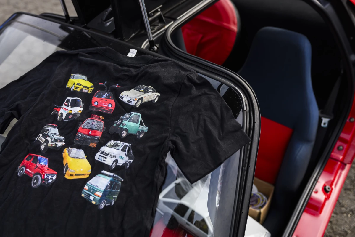 A shirt featuring a variety of kei cars was on display during a meeting of the Capital Kei Car Club.