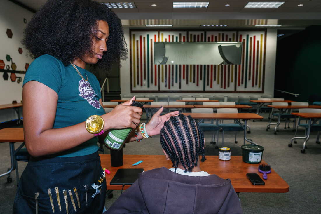 Being part of the Black Honors College has helped Naomi Thrower, a junior, get in touch with her black identity. As a side hustle she runs a natural hair business on campus and says it’s helped her develop a creative expression.