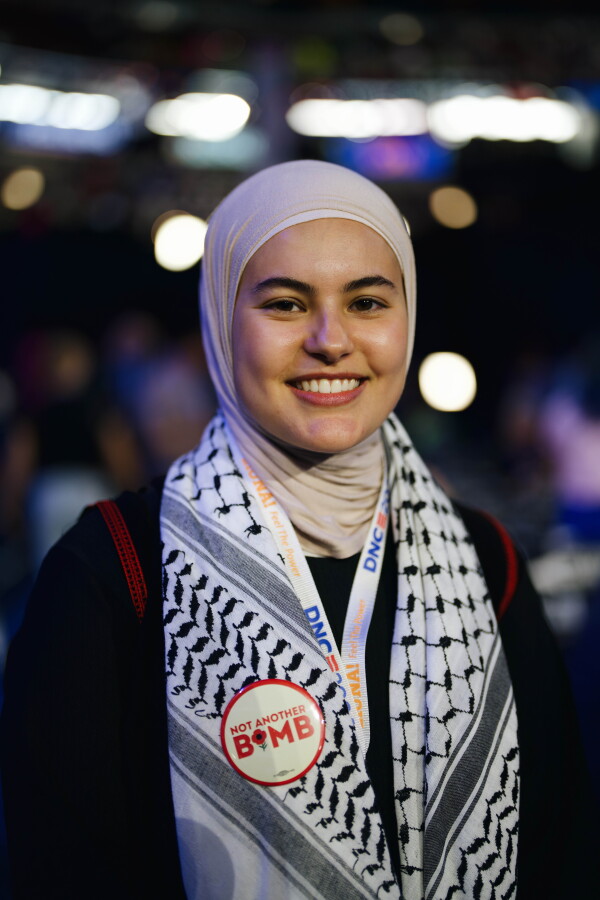 Meryem Maameri, a delegate from Twin Cities, Minn., wore a Palestinian thobe and keffiyeh to show her support for Palestinian Americans. Grace Widyatmadja/NPR