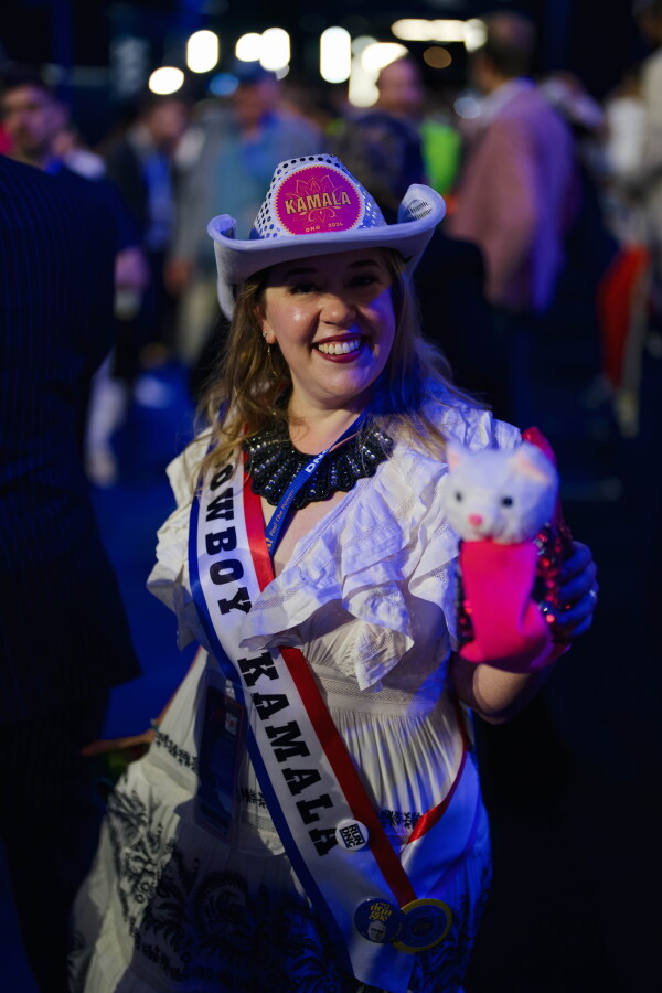 Washington delegate Ashley Fedan brought a stuff toy cat named Gina to the convention. Grace Widyatmadja/NPR