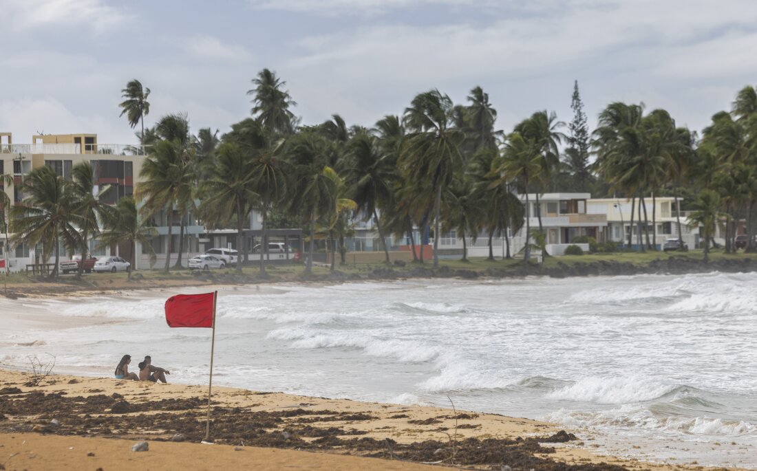 Ernesto, now a hurricane, is drenching Puerto Rico and knocking out energy