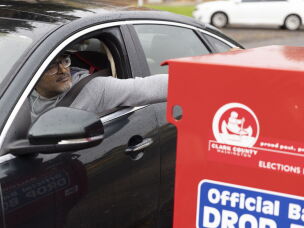 In this file photo, a voter drops his ballot in a ballot drop box in Vancouver, Wash., on Nov. 5, 2024.