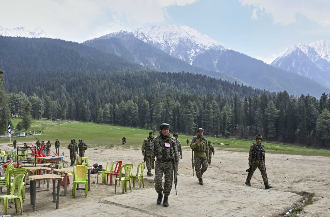 Indian security officers are shown inspecting the site where militants indiscriminately opened fired on tourists the previous day, in Pahalgam, Indian-controlled Kashmir on April 23, 2025.