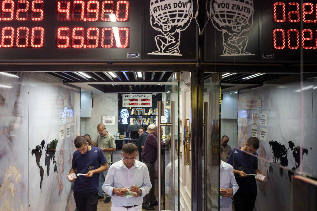 A man exchanges foreign currency at an exchange office in the Grand Bazaar in Istanbul, Turkey, on Aug. 20, 2026. The Grand Bazaar is one of the world's oldest covered markets. Today, many Turks still prefer it over banks when buying or selling gold, where they can often find better exchange rates.