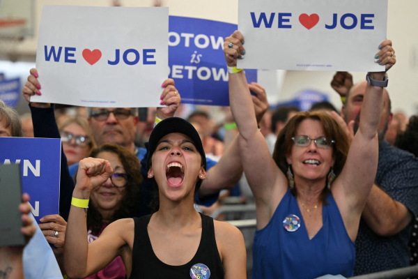 People cheer as President Biden speaks during a campaign event in Detroit on July 12, a rally where there were chants of "Don't you quit!"
