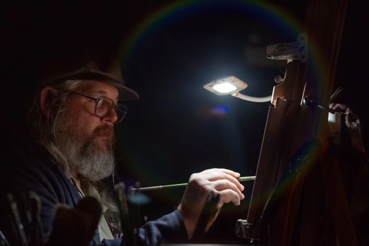 In March 2025, the University of South Alabama presented its Annual Songwriter Keynote, a conversation and concert event funded, in part, by a grant from the Alabama Humanities Alliance. Gulf Coast artist Robby Amonett, pictured above, live-painted the event.