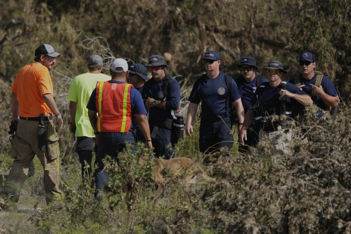 Search crews from Oklahoma Task Force One look for missing flood victims in Center Point Texas on Thursday, July 10.