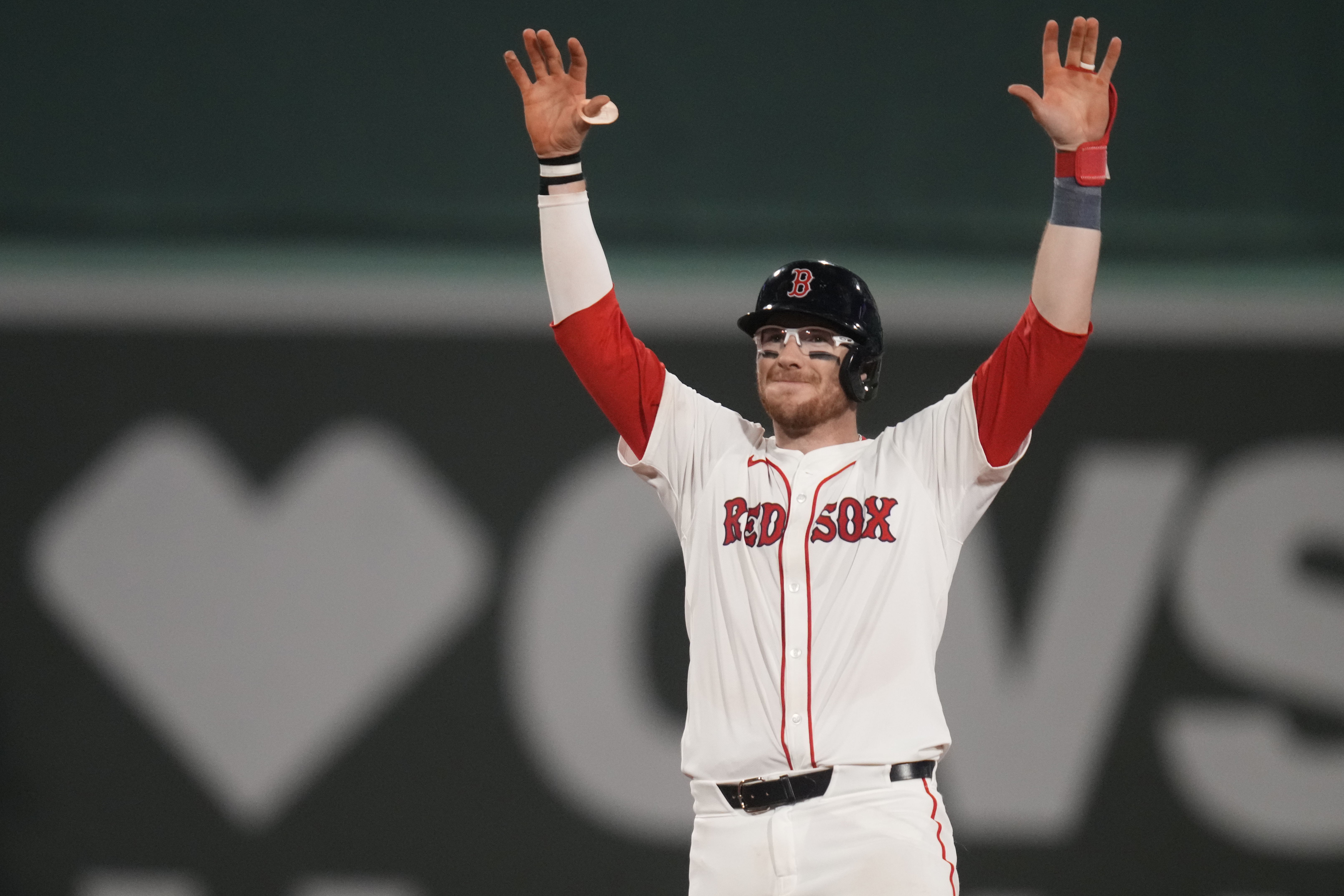 The Boston Red Sox's Danny Jansen celebrates after hitting an RBI single during the eighth inning of a baseball game against the Texas Rangers at Fenway Park, on Aug. 14 in Boston.  (AP)