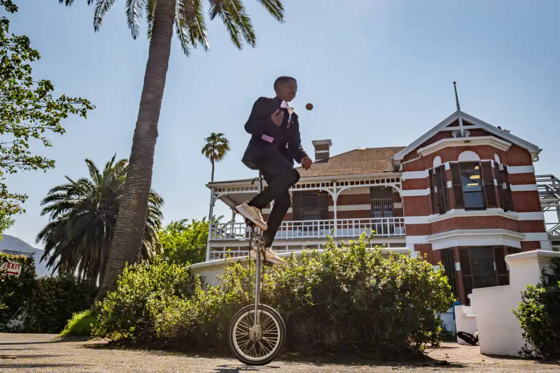Aspiring magician Sibabalwe Sibaj, 17, juggles while riding a unicycle outside the College of Magic in Cape Town, South Africa.