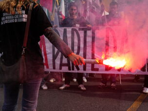 Members of right-wing student groups march through the streets of Rome, Saturday, Oct. 24, 2026, during a demonstration called