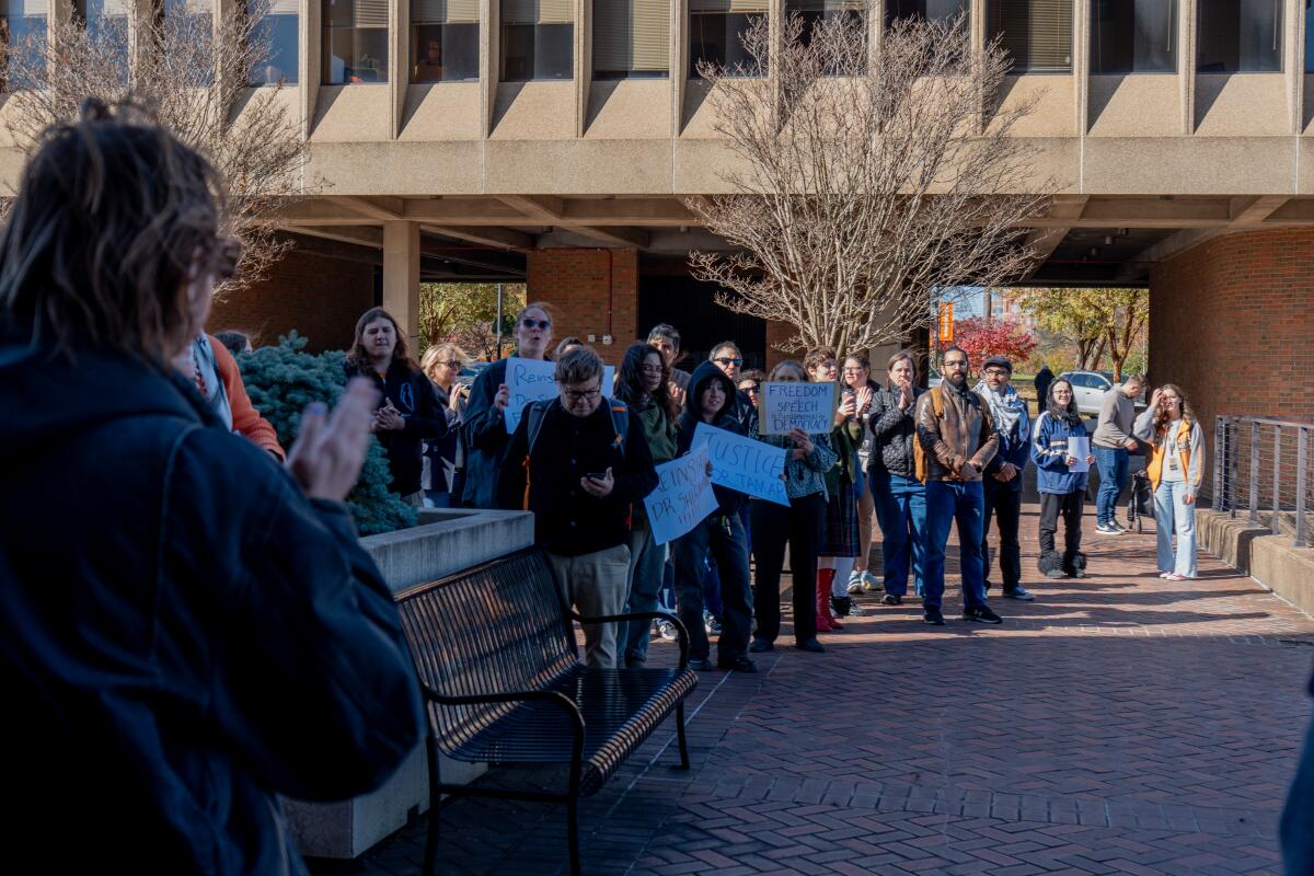 Members of the United Campus Workers Union gather at the base of Andy Holt Tower on Wednesday, Nov. 12, 2025. After rallying outside the Humanities and Social Sciences Building near the center of campus, UCW members marched to Andy Holt Tower where they hand-delivered a petition to UT Knoxville Chancellor Donde Plowman demanding the reinstatement of Tamar Shirinian.