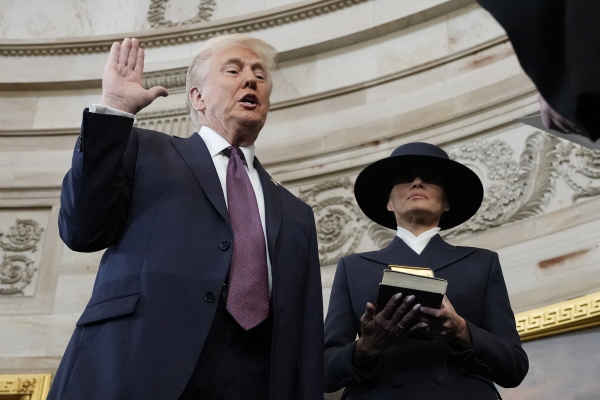 Trump is sworn in as the 47th president of the United States by Chief Justice John Roberts as Melania Trump holds the Bible on Jan. 20, 2025.
