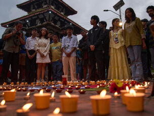 People take part in a candlelight vigil for victims of the floods in Nepal and Tibet, at Durbar Square in Kathmandu, Nepal, Saturday, Sept. 5, 2026.