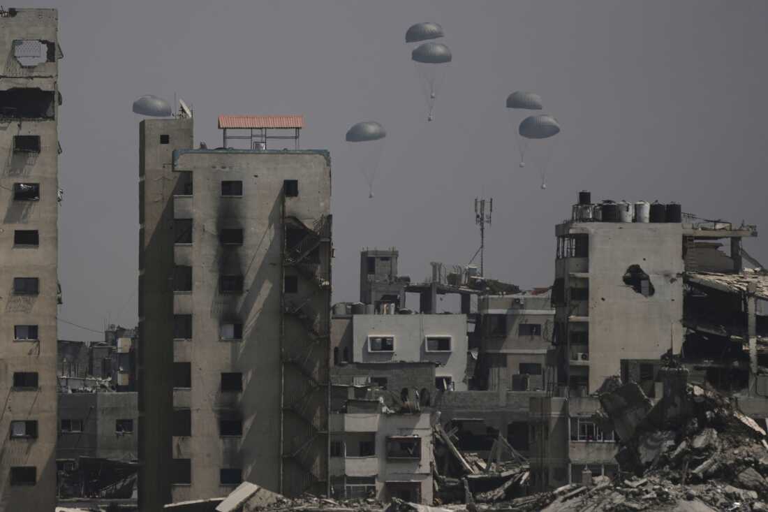 Humanitarian aid is airdropped to Palestinians over Gaza City, Gaza Strip, Monday.