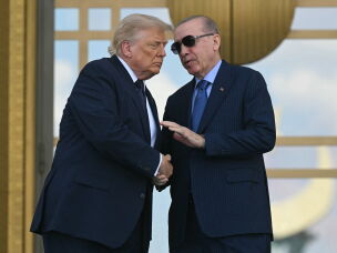 Turkish President Recep Tayyip Erdogan shakes hands with President Trump at Bestepe presidential compound in Ankara, Turkey, on the sidelines of a NATO summit, on July 7.