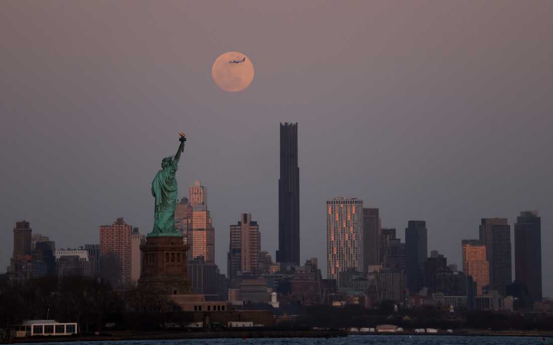 The full Worm Moon rises