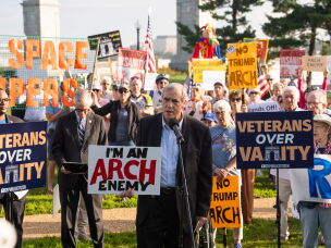 Sen. Jeff Merkley, D-Ore., speaks to demonstrators at Thursday's event. His efforts to block federal funding for the arch were rejected by a GOP senator earlier in the week.