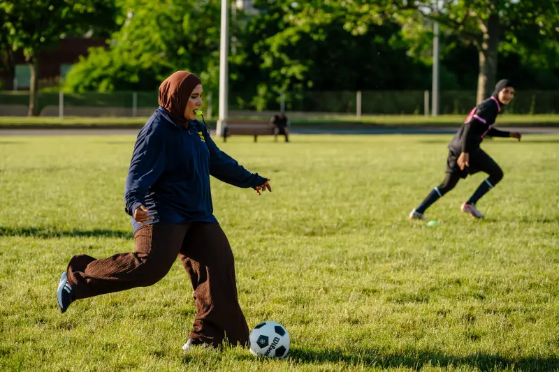 Dearborn, MI - June 11, 2026: The Michigan FC girls' team coach Zharaa Alhamidy, 22, at a practice in Dearborn, MI. (Photo by Nick Hagen for NPR)