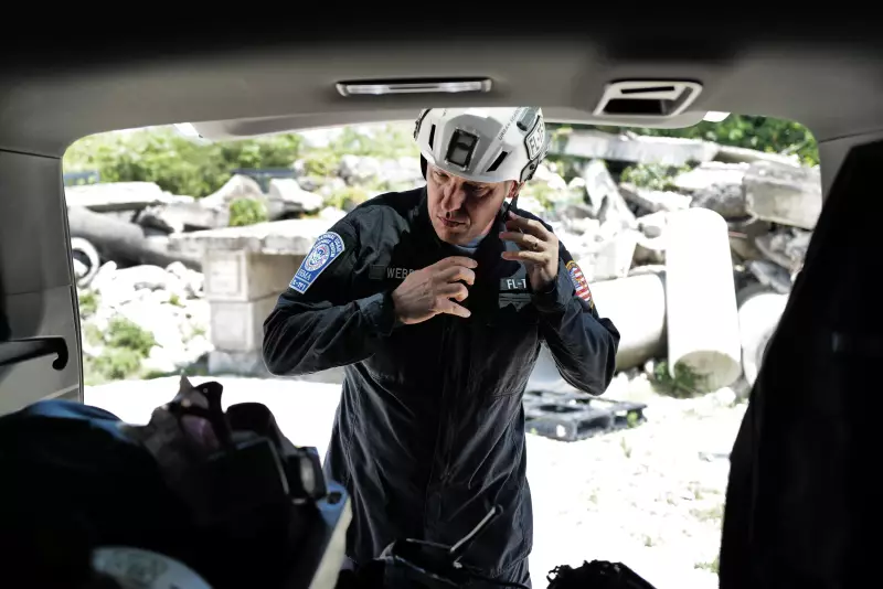 Chief Brandon Webb of Florida Task Force 1 puts on rescue gear at a training center in Miami. The elite search and rescue team trains regularly on how to respond to calamities like the Surfside Collapse around the world.