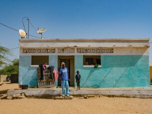 Abou Diallo was able to paint and renovate his house from the extra money he earned after adding fish to his rice farm boosted crop yields.