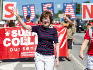 Sen. Susan Collins, R-Maine, walks in the annual Moxie Day Parade on July 11 in Lisbon, Maine.