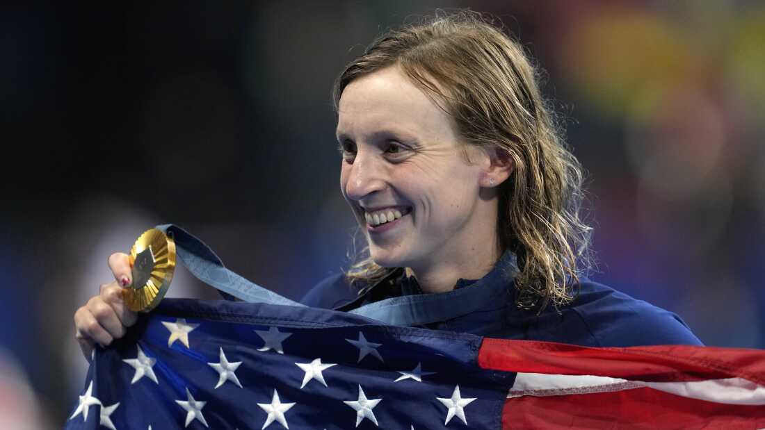 Katie Ledecky of the United States poses after winning the women's 1,500m freestyle final at the 2024 Summer Olympics in Nanterre, France, Wednesday, July 31, 2024. On Thursday, she won the silver medal, bringing her medal total to thirteen, more than any other female swimmer in Olympic history. (AP Photo/Ashley Landis)