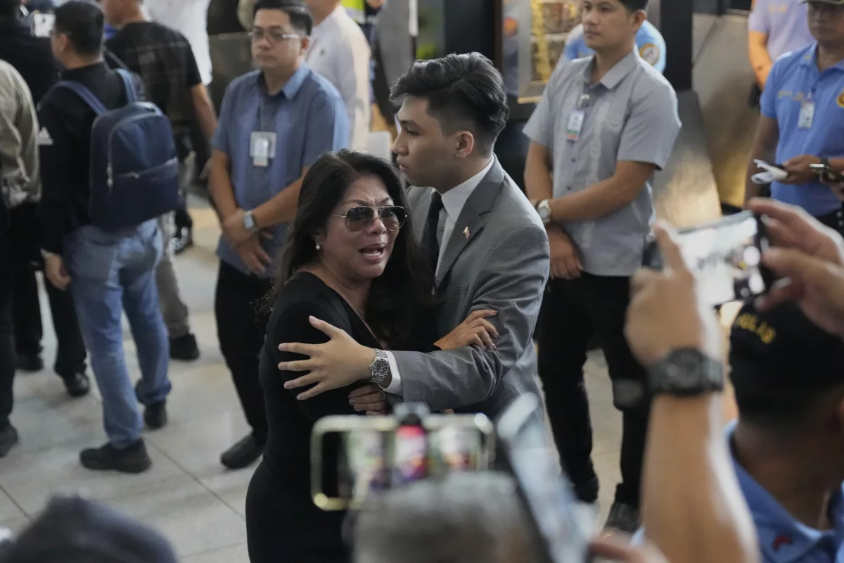 A supporter of former President Rodrigo Duterte reacts upon finding out he was arrested, at the airport in Manila, Philippines, Tuesday, March 11, 2025.