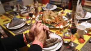 Central American immigrants and their families pray before Thanksgiving dinner on Nov. 24, 2016 in Stamford, Connecticut.
