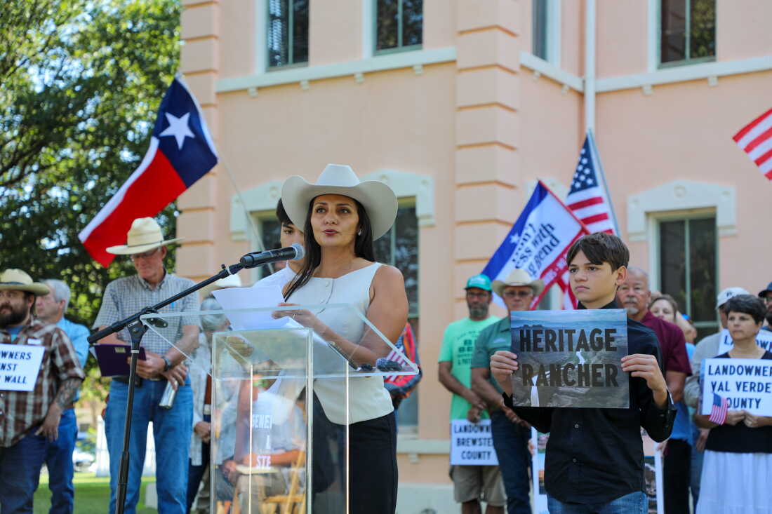 Yolanda Alvarado, a fifth-generation cattle rancher in west Texas, stands with her sons at a press conference on Monday in Marfa, announcing a landowner lawsuit against a proposed border wall along the border with Mexico.